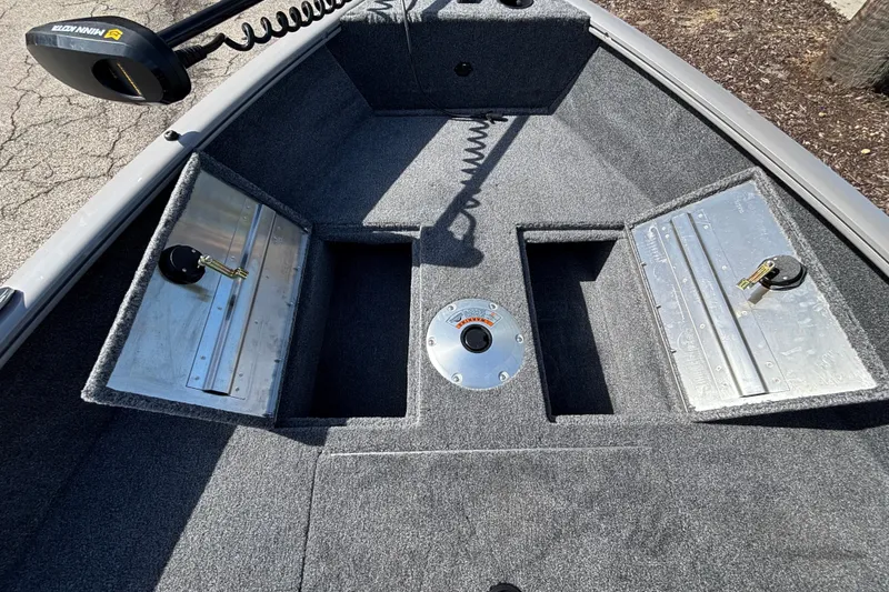 Slide: The Image of Interior of 2027 Tracker Super Guide V-16 SC boat with storage compartments. - 14