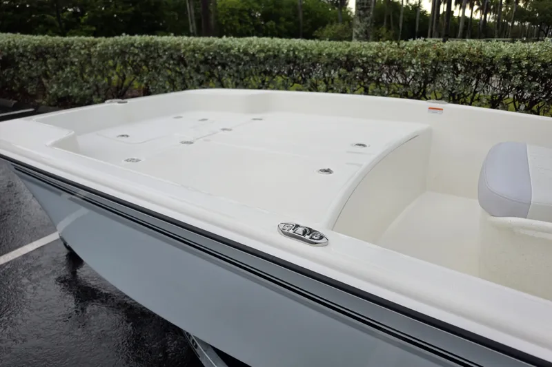 Slide: The Image of 2027 Mako Pro Skiff 17 CC boat, white deck, sleek design, outdoor setting. - 5