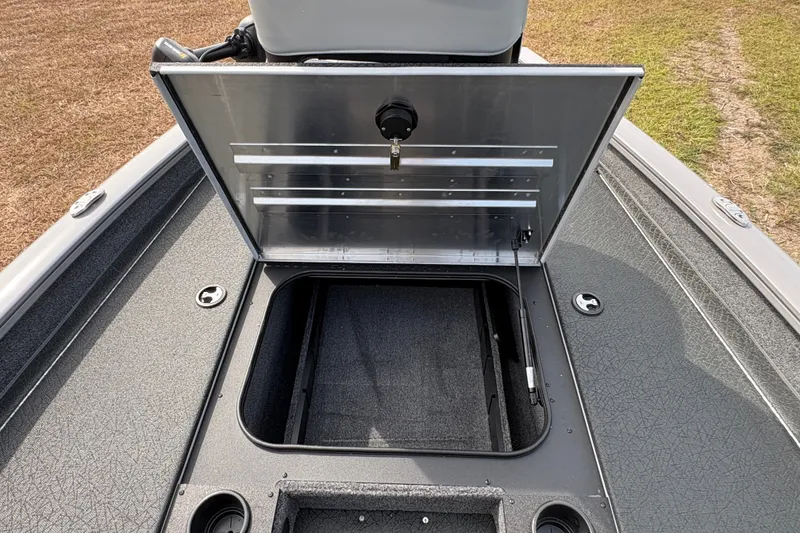 Slide: The Image of Open storage compartment on 2027 Tracker Pro Team 175 boat, showcasing interior space. - 17