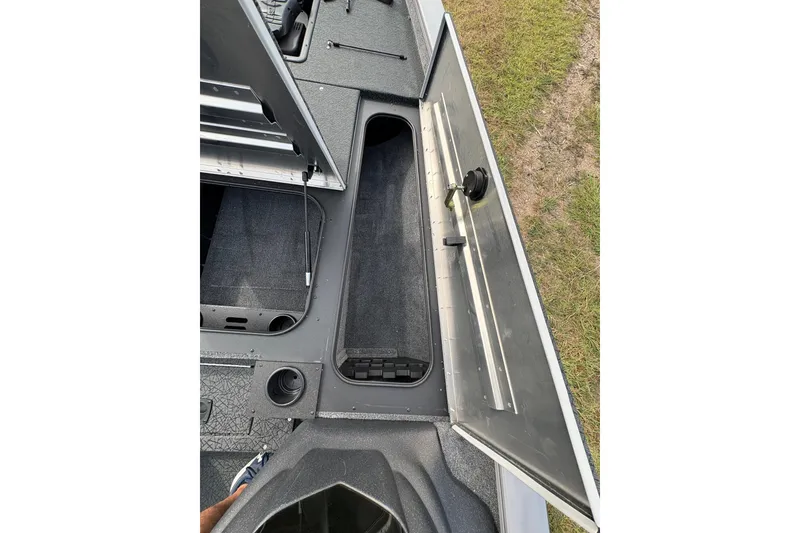 Slide: The Image of Interior view of a 2027 Tracker Pro Team 175 boat storage compartment. - 20