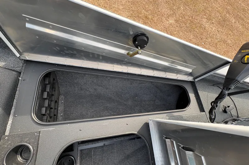 Slide: The Image of Interior view of a 2027 Tracker Pro Team 175 boat storage compartment. - 19