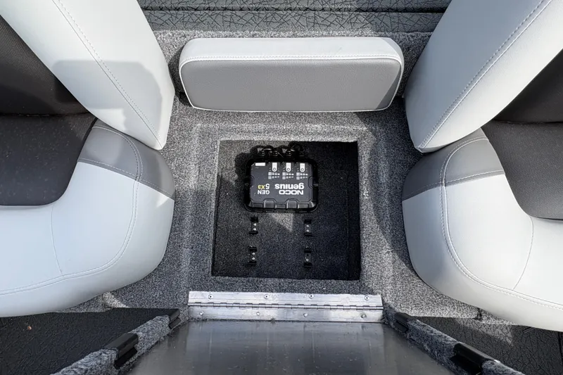 Slide: The Image of Interior of 2027 Tracker Pro Team 175 boat with NOCO Genius battery charger. - 14