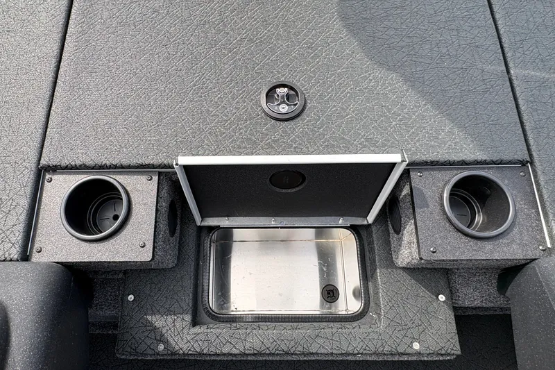 Slide: The Image of 2027 Tracker Pro Team 175 boat interior with storage compartment and cup holders. - 16