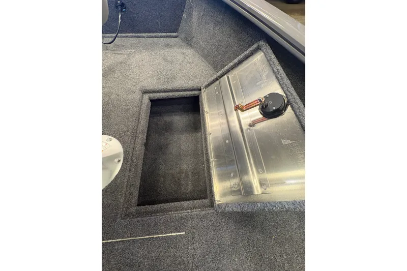 Slide: The Image of Interior view of 2027 Tracker Super Guide V-16 SC boat storage compartment. - 14