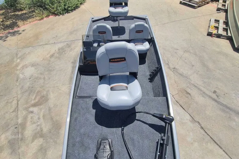Slide: The Image of 2027 Tracker Bass Tracker Classic Limited boat with gray seating and carpeted deck. - 13