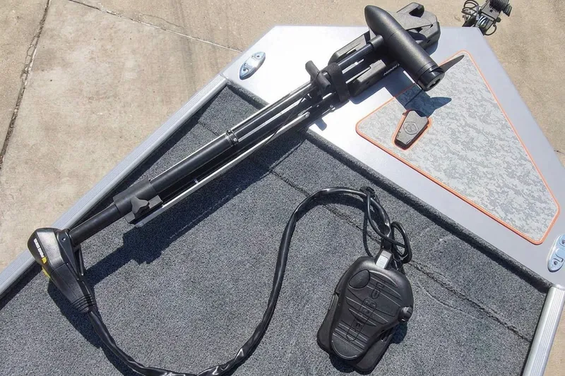 Slide: The Image of Trolling motor and foot pedal on 2027 Tracker Bass Tracker Classic Limited boat deck. - 14