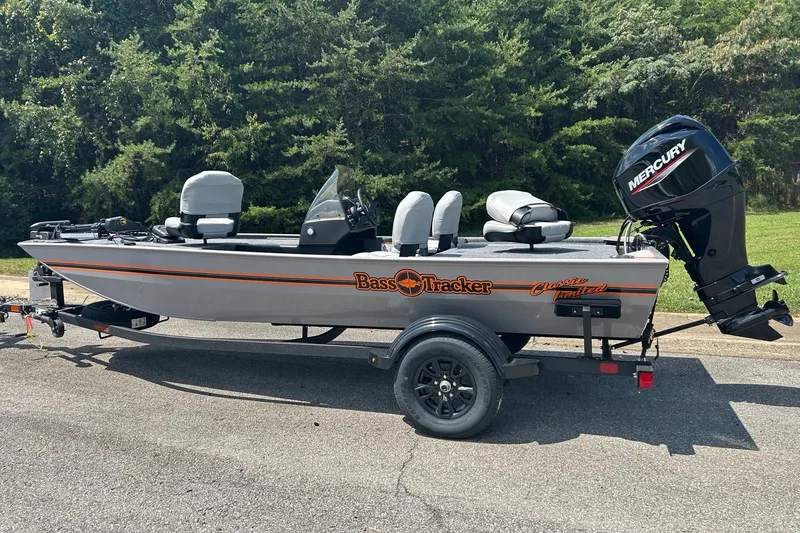 The Image of 2027 Tracker Bass Tracker Classic Limited boat with Mercury engine on trailer. - 0