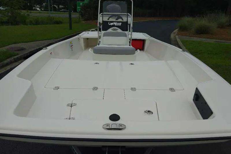 Slide: The Image of 2027 Mako Pro Skiff 17 CC boat with spacious deck and center console. - 9