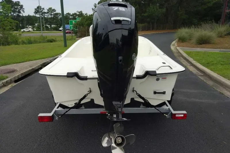 Slide: The Image of 2027 Mako Pro Skiff 17 CC with Mercury 75 engine on trailer, parked outdoors. - 5