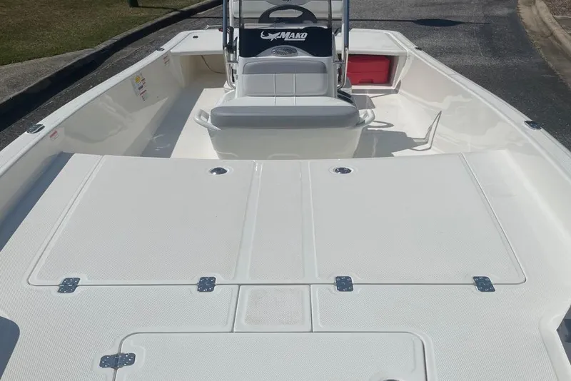 Slide: The Image of 2027 Mako Pro Skiff 17 CC boat interior with spacious deck and seating. - 2