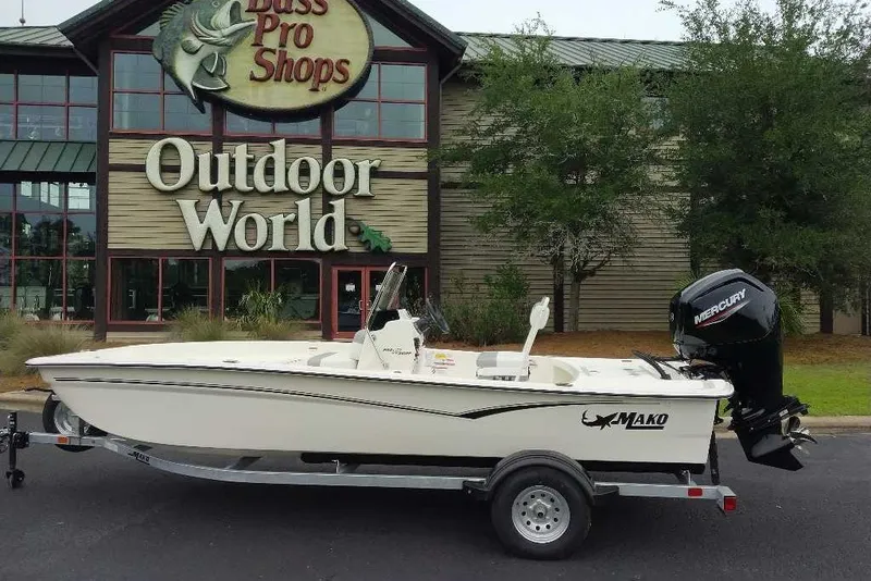 Slide: The Image of 2027 Mako Pro Skiff 17 CC boat on trailer outside Bass Pro Shops Outdoor World. - 10
