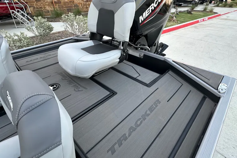 Slide: The Image of 2027 Tracker Pro 170 boat interior with seating and Mercury engine. - 14