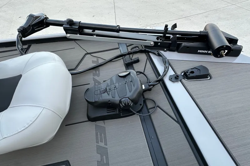 Slide: The Image of 2027 Tracker Pro 170 boat deck with Minn Kota trolling motor and white seat. - 16