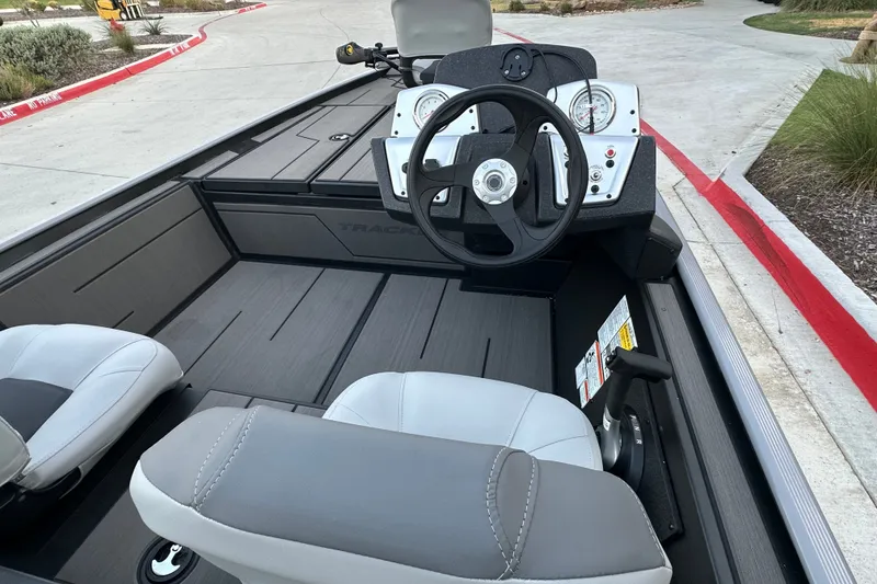 Slide: The Image of 2027 Tracker Pro 170 boat interior with steering wheel and seats. - 15