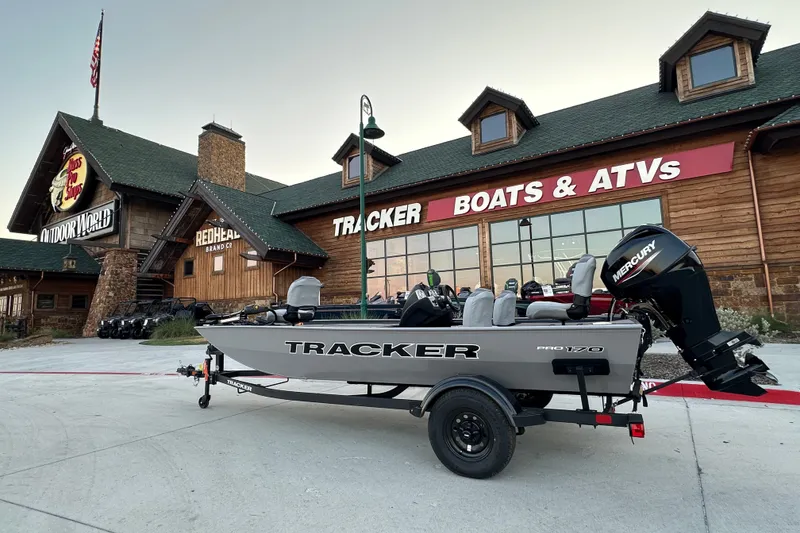 The Image of 2027 Tracker Pro 170 boat displayed outside Tracker Boats & ATVs store. - 1