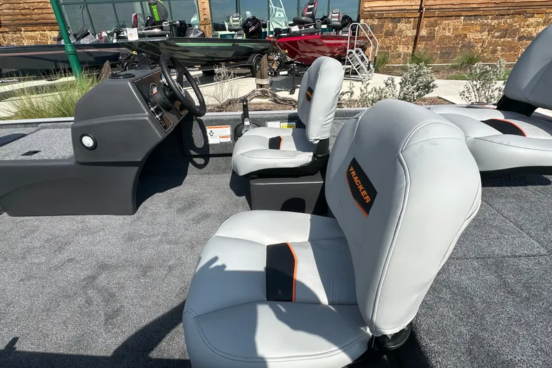 Slide: The Image of 2027 Tracker Bass Tracker Classic Limited boat interior with gray seats and steering console. - 21