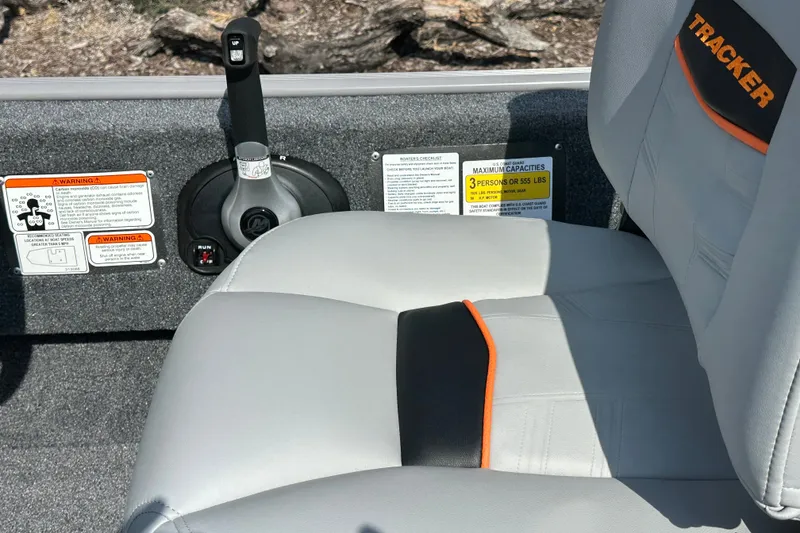 Slide: The Image of 2027 Tracker Bass Tracker Classic Limited boat seat with safety warnings and capacity label. - 20