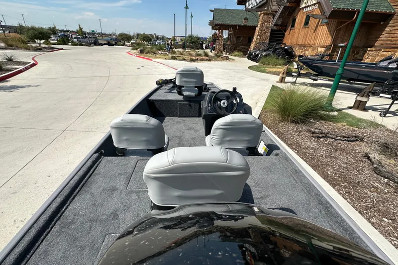 Slide: The Image of 2027 Tracker Bass Tracker Classic Limited boat interior with seating and steering wheel. - 19
