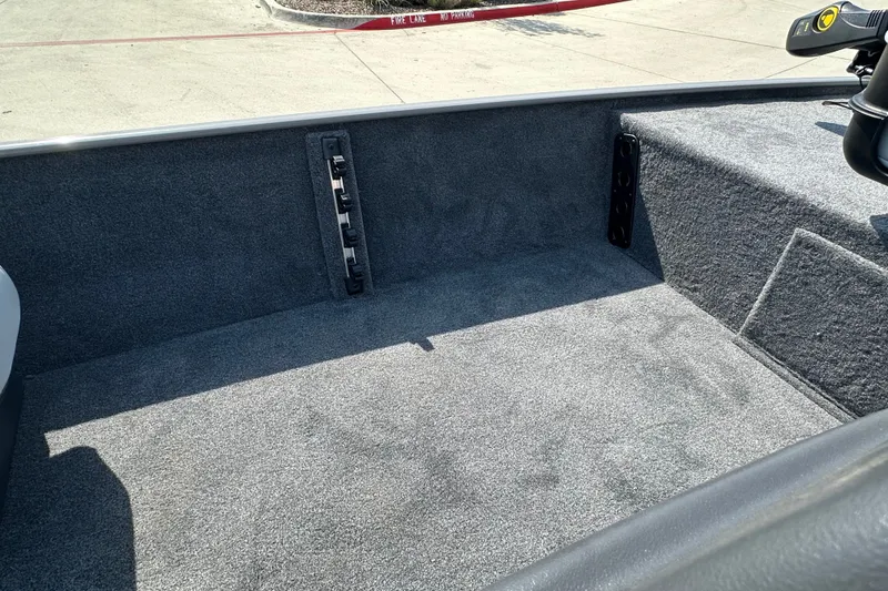 Slide: The Image of Interior view of 2027 Tracker Bass Tracker Classic Limited boat, featuring carpeted flooring. - 17