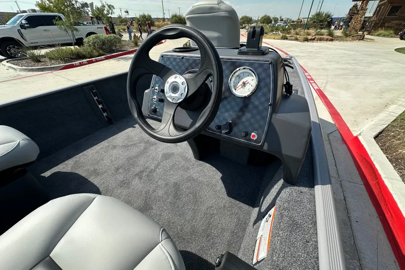 Slide: The Image of Interior view of 2027 Tracker Bass Tracker Classic Limited boat, featuring steering wheel and dashboard. - 16