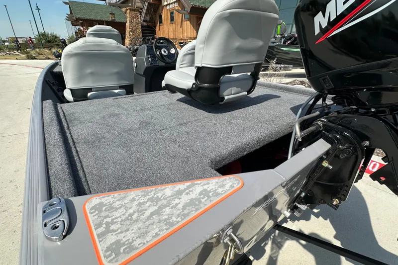 Slide: The Image of 2027 Tracker Bass Tracker Classic Limited boat with gray seating and Mercury engine. - 18