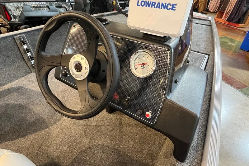 Slide: The Image of Steering console of 2027 Tracker Bass Tracker Classic Limited boat with Lowrance display. - 16