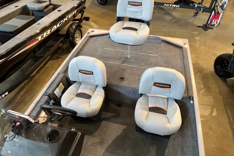 Slide: The Image of 2027 Tracker Bass Tracker Classic Limited boat interior with three cushioned seats. - 23