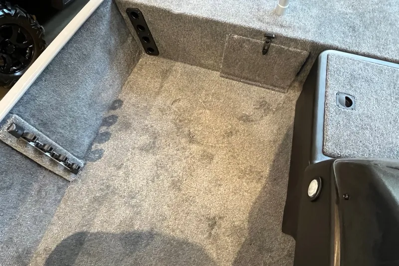 Slide: The Image of Interior of 2027 Tracker Bass Tracker Classic Limited boat with carpeted flooring. - 19