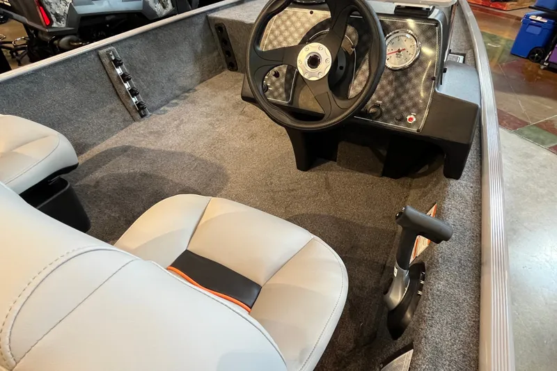 Slide: The Image of Interior of 2027 Tracker Bass Tracker Classic Limited boat with steering wheel and seats. - 18