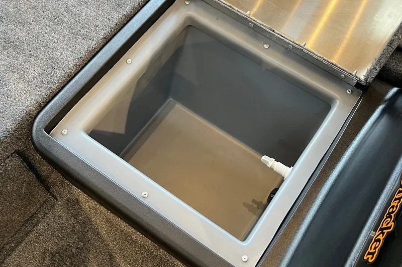 Slide: The Image of Open storage compartment in 2027 Tracker Bass Tracker Classic Limited boat. - 22