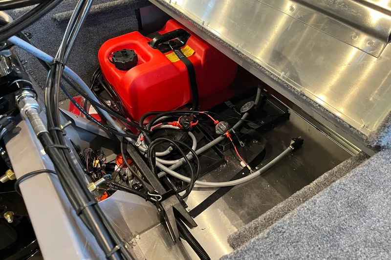 Slide: The Image of 2027 Tracker Bass Tracker Classic Limited boat interior with red fuel tank and wiring. - 25