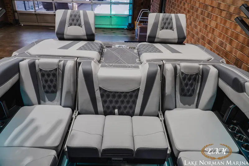 Slide: The Image of Luxurious interior of 2027 Malibu M230 boat with plush seating and modern design. - 32