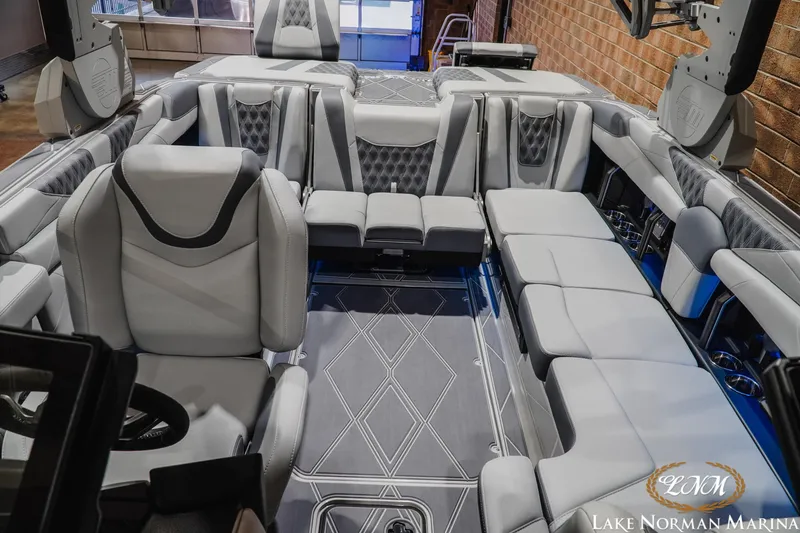 Slide: The Image of Luxurious interior of 2027 Malibu M230 boat with plush seating and modern design. - 30