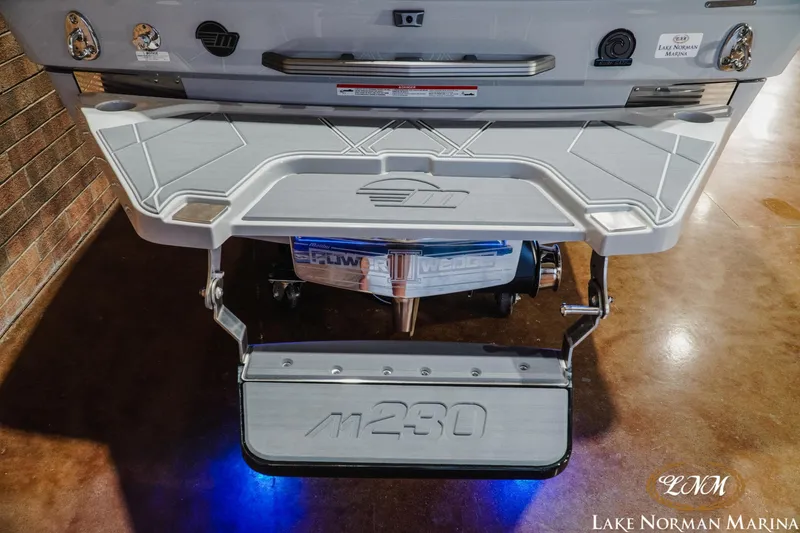Slide: The Image of 2027 Malibu M230 boat rear view with swim platform at Lake Norman Marina. - 12