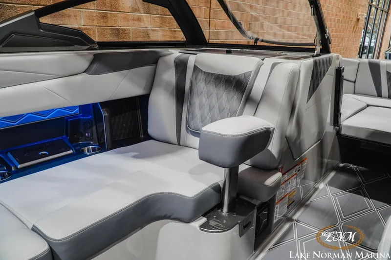 Slide: The Image of Luxurious interior of 2027 Malibu M230 boat with modern seating and ambient lighting. - 27