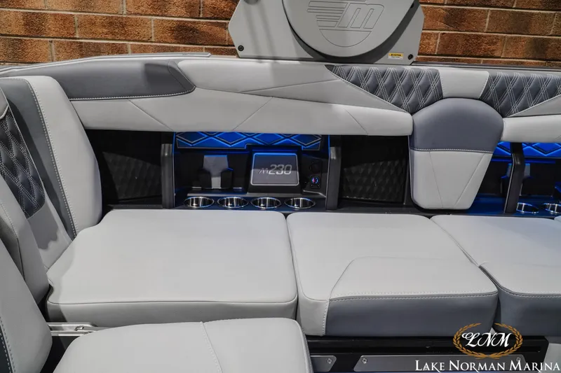 Slide: The Image of Luxurious interior of 2027 Malibu M230 boat with sleek seating and modern design elements. - 18