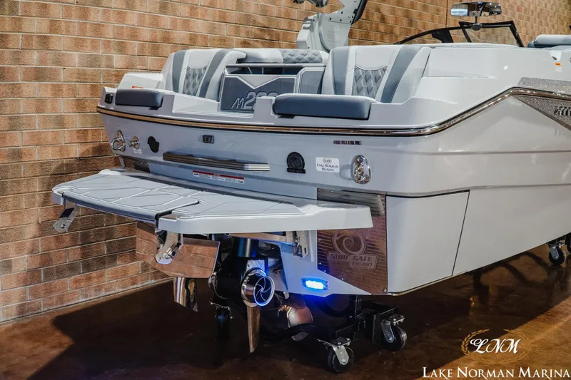 Slide: The Image of 2027 Malibu M230 boat at Lake Norman Marina, showcasing sleek design and advanced features. - 8
