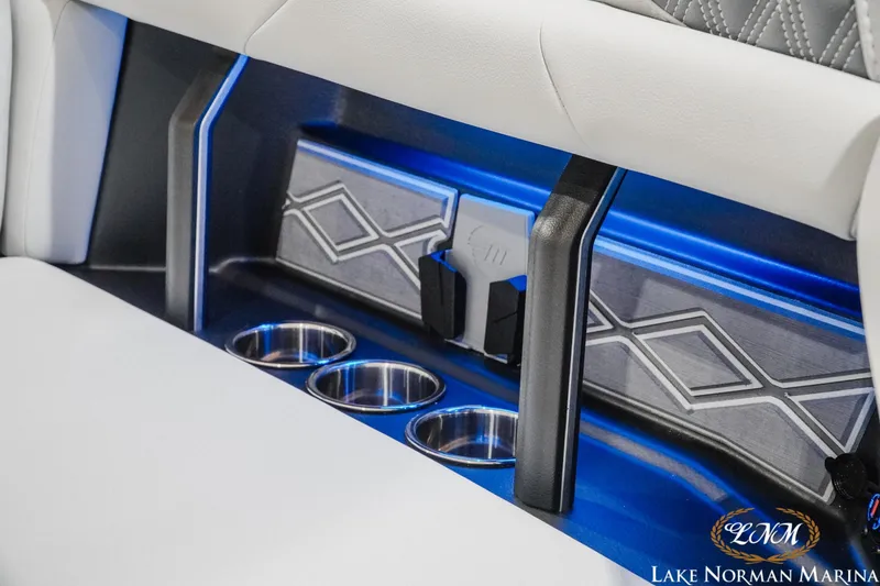 Slide: The Image of Interior of 2027 Malibu M230 boat with cup holders and modern design accents. - 7