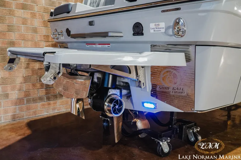 Slide: The Image of 2027 Malibu M230 boat rear view with Surf Gate system at Lake Norman Marina. - 9