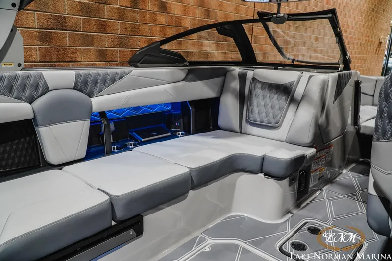 Slide: The Image of Luxurious interior of 2027 Malibu M230 boat with modern seating and elegant design. - 17