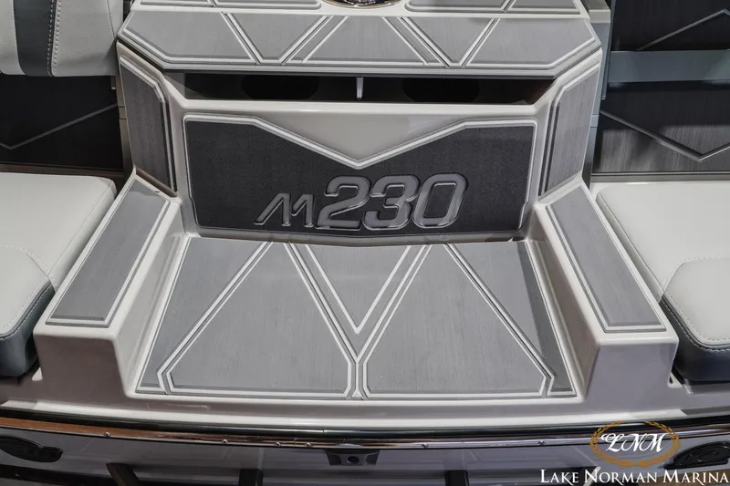 Slide: The Image of 2027 Malibu M230 boat interior with sleek, modern design at Lake Norman Marina. - 14