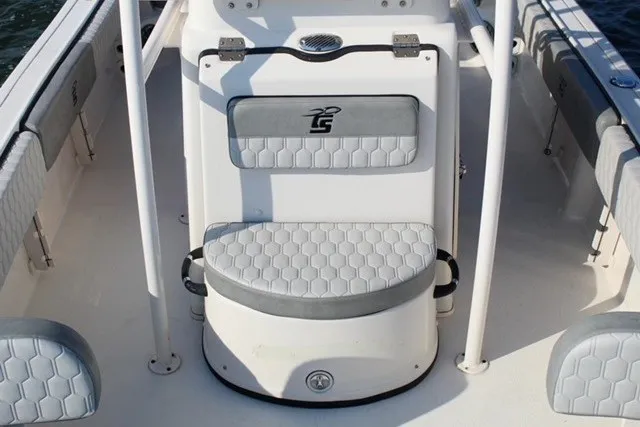 Slide: The Image of 2025 Carolina Skiff 21 Ultra Elite boat interior with cushioned seating and storage. - 7