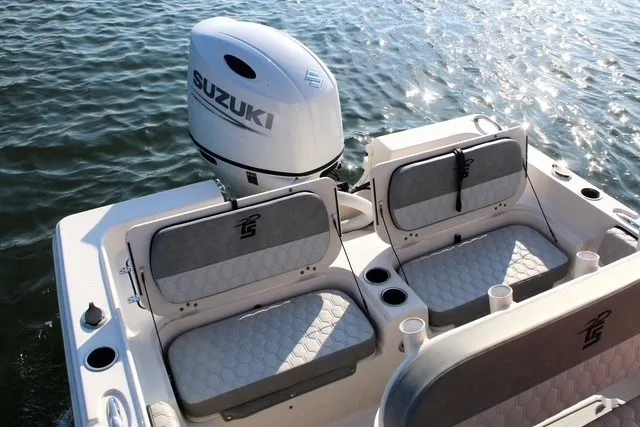 Slide: The Image of 2025 Carolina Skiff 21 Ultra Elite boat with Suzuki engine on water. - 10