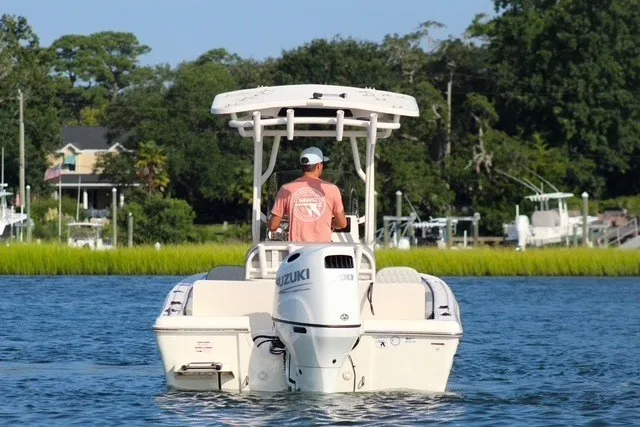Slide: The Image of 2025 Carolina Skiff 21 Ultra Elite boat cruising on a serene waterway. - 3