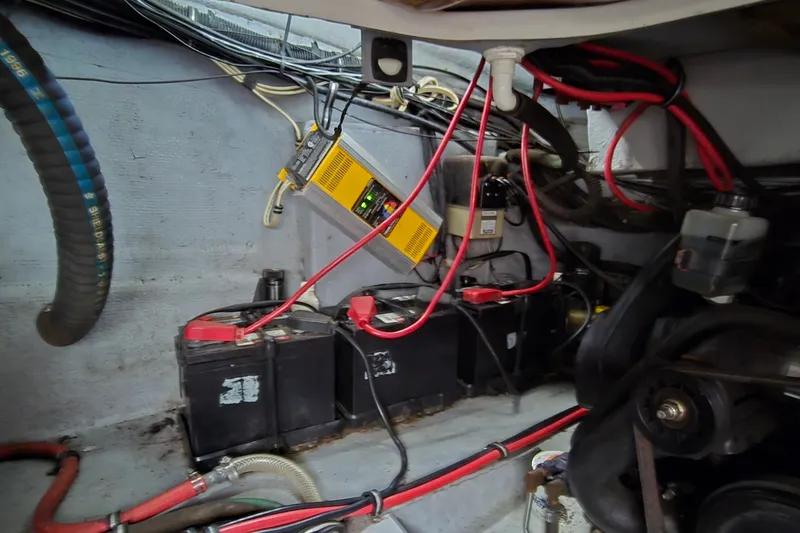 Slide: The Image of Engine compartment of a 1998 Chaparral Signature 300 with batteries and wiring. - 34