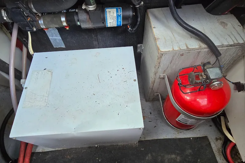 Slide: The Image of Engine compartment of a 1998 Chaparral Signature 300 with fire extinguisher and electrical components. - 39