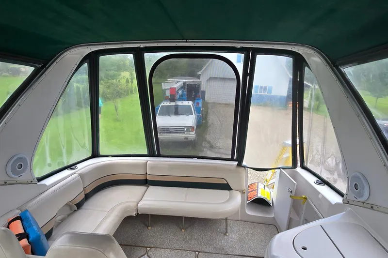 Slide: The Image of 1998 Chaparral Signature 300 boat interior with curved seating and large windows. - 16