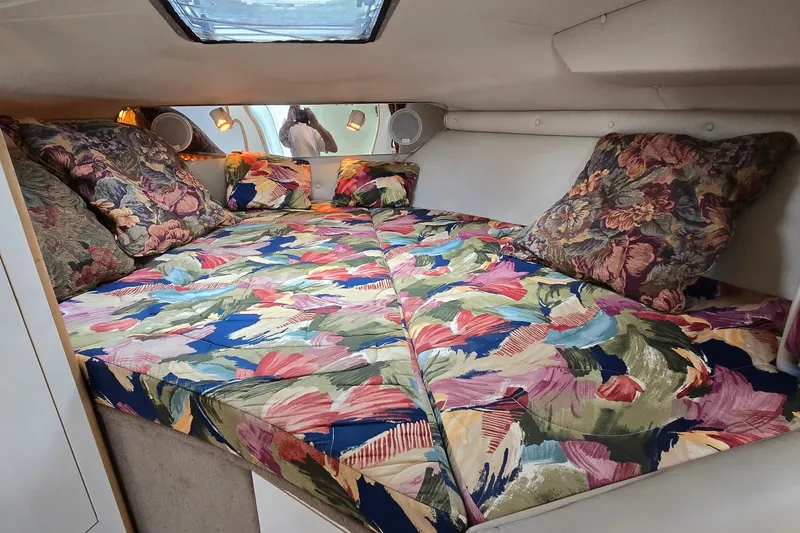 Slide: The Image of Interior cabin of 1998 Chaparral Signature 300 with colorful floral bedding. - 19