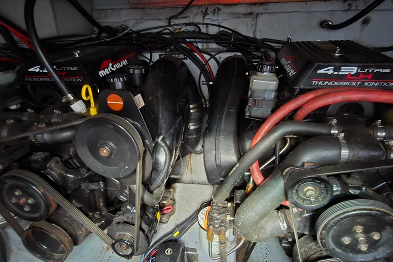 Slide: The Image of Engine compartment of a 1998 Chaparral Signature 300 boat with MerCruiser components. - 35