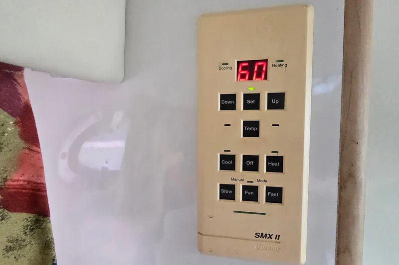 Slide: The Image of Thermostat control panel on a 1998 Chaparral Signature 300 boat, displaying temperature settings. - 31